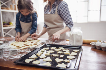 Mom and daughter baking
