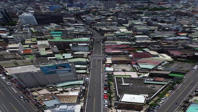 Aerial 4K Drone Footage of Chiayi City by drone in Taiwan. Bustling city, transportation shot from above. Aerial vertical video, vertical video background.