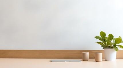 Obraz na płótnie Canvas A minimalist office desk bathed in gentle natural light, featuring a laptop.
