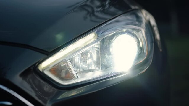 Close-up of Full beam headlights in Car. Headlight of a car