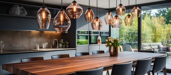 Fototapeta na wymiar Contemporary pendant lighting above wooden island in kitchen