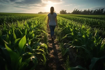 Foto op Plexiglas Agriculture. female farmer wearing rubber boots. Working along the sunshine near the green corn fields. AI generative © Attasit