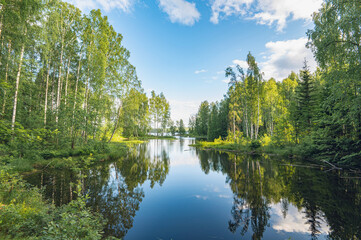 Summer river landscape with beautiful birches on the shore. Chusovaya River, Ural, Russia