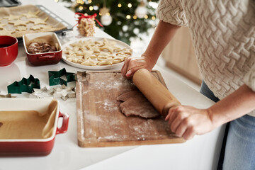Unrecognizable woman preparing dough for the Christmas cookies