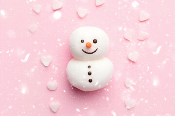 Snowman Marshmallow on Pastel Pink Background