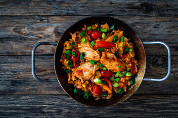 Jambalaya one pot dish - fried chicken breasts with white rice, tomatoes, bell pepper and celery on...