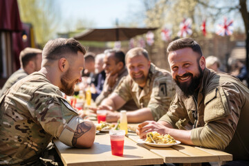 Group of happy military men, smiles soldier war veterans on a sunny day in a street cafe sharing memories and talking about service together. Lifestyles and friendship. Celebrating Remembrance Day - obrazy, fototapety, plakaty