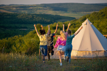 In the summer day int he middle of nature at the campsite group of people meeting together to chilling capturing amazing landscape