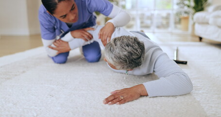 Fall, accident or emergency with a nurse and old woman on the floor of an assisted living house or...