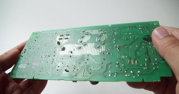 Close-up of circuit board components under a thorough inspection by an expert technician