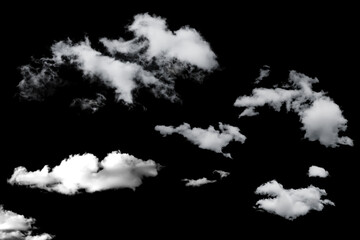 white fluffy clouds standing out against a black background