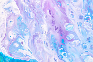 Exclusive beautiful pattern, abstract fluid art background. Flow of blending purple lilac blue paints mixing together. Blots and streaks of ink texture for print and design.