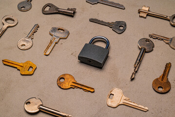check-lock and different keys on concrete background concept