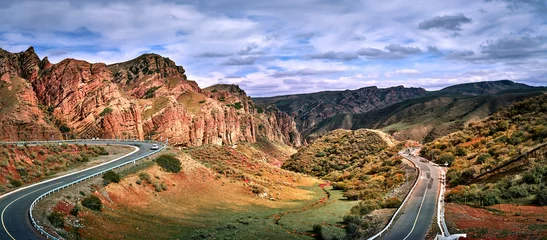 Fotobehang In the southern part of Changji City, Xinjiang, China, there is a provincial highway S101, known as the "Tianshan Geographical Scenic Corridor", with Danxia landform and beautiful scenery. © sunlinght
