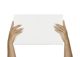 Adult female hands with long square ombre manicured nails, holding up a rectangular white board with copy space. Isolated cutout on a transparent background.