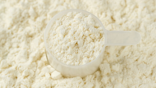 White protein, whey powder in cup. Bodybuilding, fitness and gym lifestyle