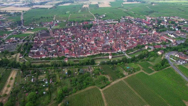 Aerial view above the beautiful French village of Bergheim and its surrounding vineyards - Alsace, France