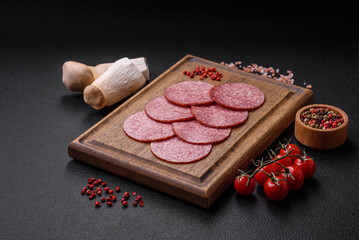 Delicious fresh smoked sausage with salt and spices cut into slices