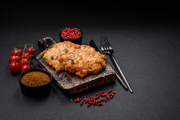 Delicious fried chicken chop or pork meat fried breaded with salt, spices and herbs