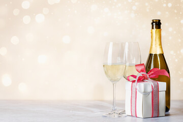Two champagne glasses and gift box