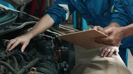 Car repair technicians at a complete garage, sending cars to the center, professional car inspections, car maintenance, professional car mechanics. Concepts of car inspection and repair.