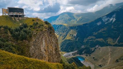 Fototapeta na wymiar Panorama of the Caucasus mountains with the Russo-Georgian Friendship Monument. 