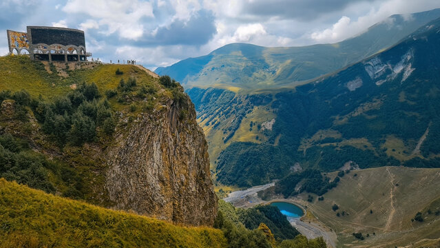 Panorama of the Caucasus mountains with the Russo-Georgian Friendship Monument. 