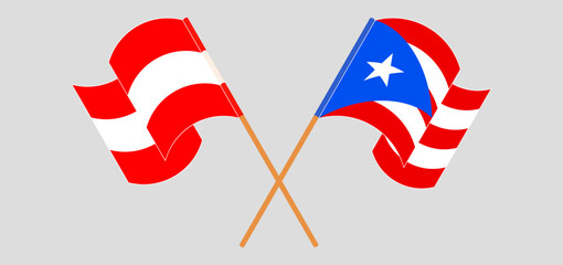 Crossed and waving flags of Austria and Puerto Rico