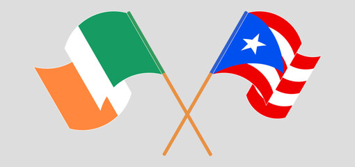 Crossed and waving flags of Ireland and Puerto Rico