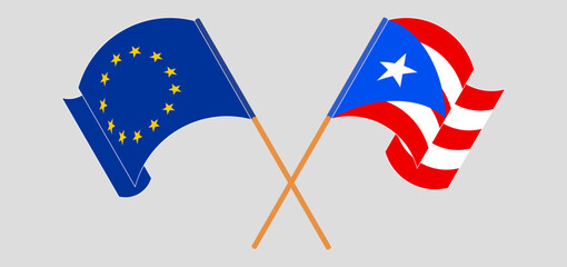 Crossed and waving flags of the European Union and Puerto Rico