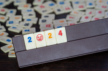 Rummikub tiles on the table, awaiting new year 2024 with board games