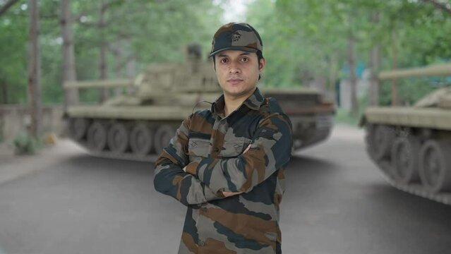 Portrait of Indian army man standing crossed hands