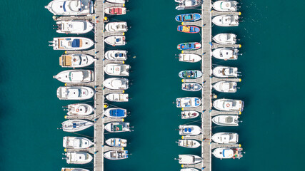 Bird's eye view of many boats in dock in the sea