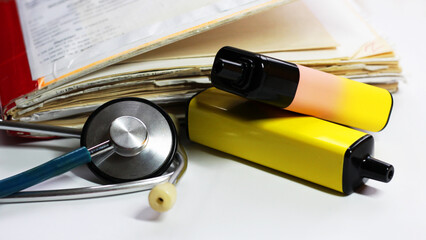 A stethoscope and an e-cigarette, a fancy device 