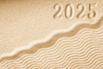 Imprints of numbers 2025 new year on a golden sand waves