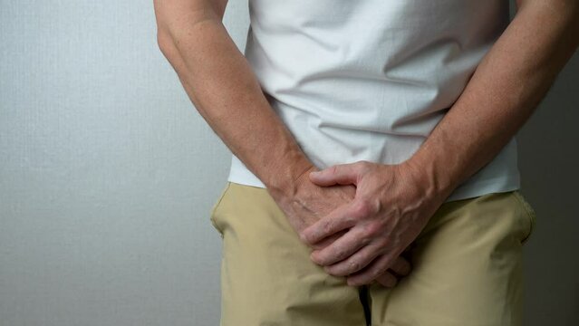 Man want to pee and is holding his bladder