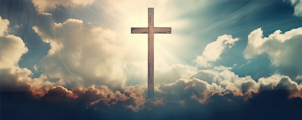 Fototapeta premium cross in clouds symbol of the death and resurrection , copy space for text.