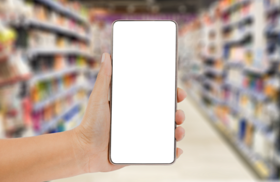 Hand holding a smartphone on blurred market background. Transparent mobile screen mockup. Shopping online or technology concept. - Powered by Adobe