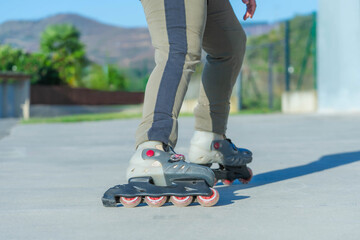 skater on a paved road outdoors on a hot day