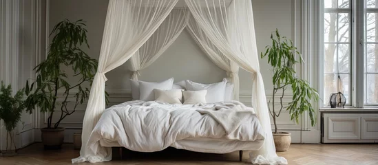 Selbstklebende Fototapete Stockholm Canopy bed in Stockholm home with white linens