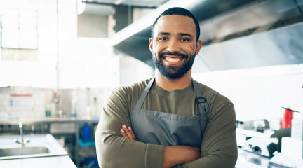 Happy man, face and small business owner in kitchen at restaurant for hospitality service, cooking...