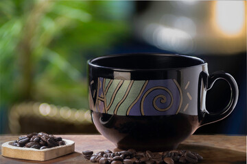 Obraz na płótnie Canvas Black cup and coffee beans with selective focus
