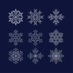 Set of nine complex different openwork smooth white snowflakes with a contour on a dark blue background