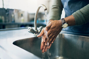 Water, hygiene and washing hands in the kitchen with a person by the sink for health or wellness. Cleaning, safety and bacteria with an adult closeup in the home to rinse for skin protection - obrazy, fototapety, plakaty