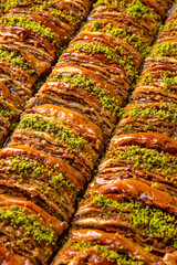 Turkish desert baklava with peanut, pistachio for holiday or ramadan. Traditional Middle Eastern Flavors. Selective focus, pattern.
