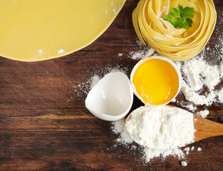 homemade raw pasta on wooden table