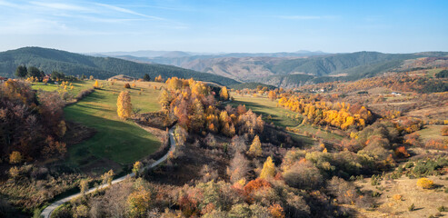 Colorful view of an autumn mountain with peaks, meadows and colorful forests of Dinaric Alps, near Zlatibor, Serbia