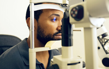Man, eye exam and ophthalmology for medical, vision and healthcare consultation with glaucoma check. African person or client with laser, blue light and machine for scanning and optometry in office