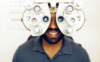 Eye test, face or happy man consulting to help eyesight at optometrist for a optical assessment. Optometry, wellness or customer in clinic for vision, iris or retina health with machine or phoropter - obrazy, fototapety, plakaty