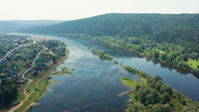 Southern Urals in summer, the Ufa River near the village of Krasny Klyuch. Aerial view.